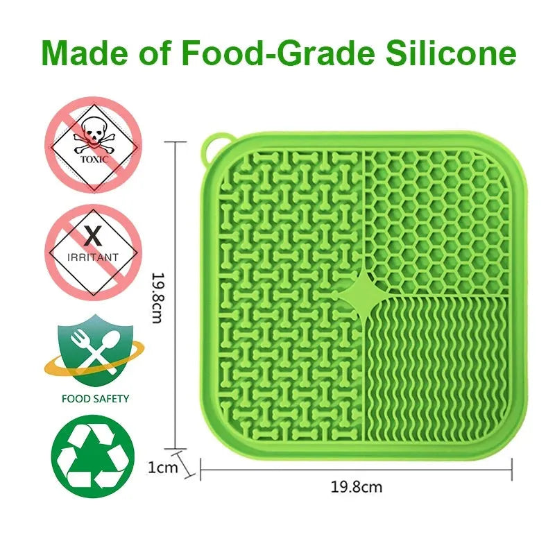 Blue silicone dog licking mat with suction cups on a smooth surface