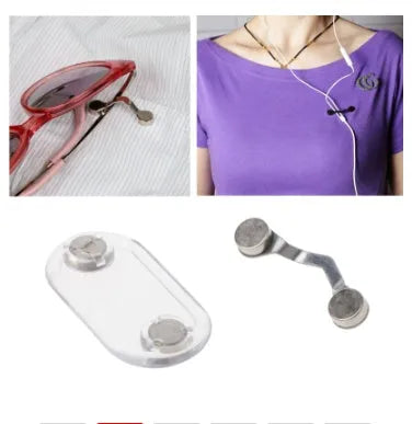 Black magnetic glasses holder attached to car dashboard with spectacles stored on bracket