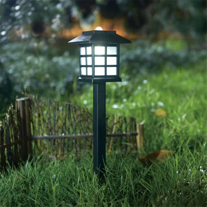 Solar square lawn light with LED, IP44, in a garden setting showing white light illumination