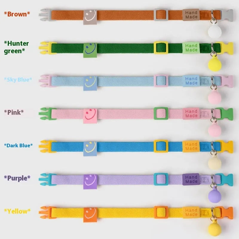 Small dog polyester pet collar in various solid colours showing high elastic adjustable band.