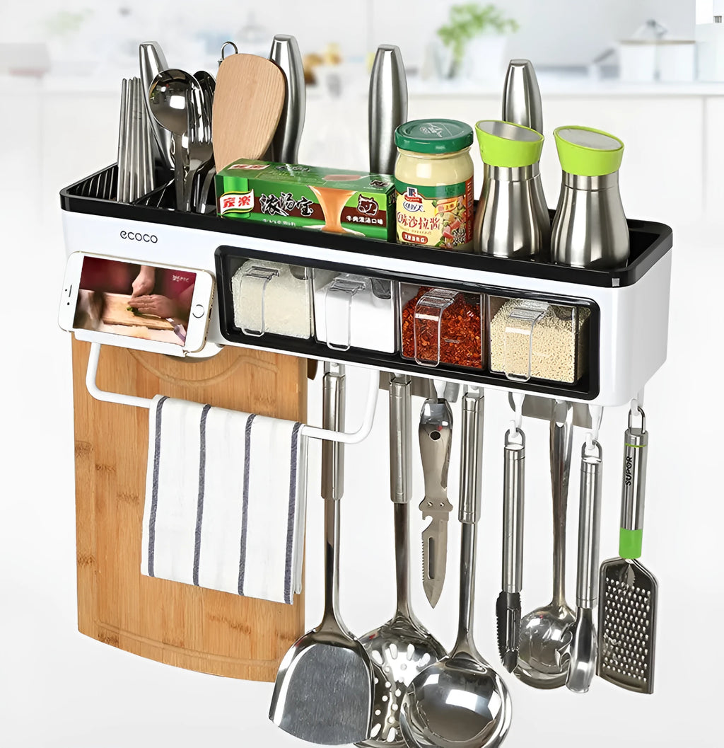 White plastic wall-mounted kitchen storage box with compartments for tools and seasonings