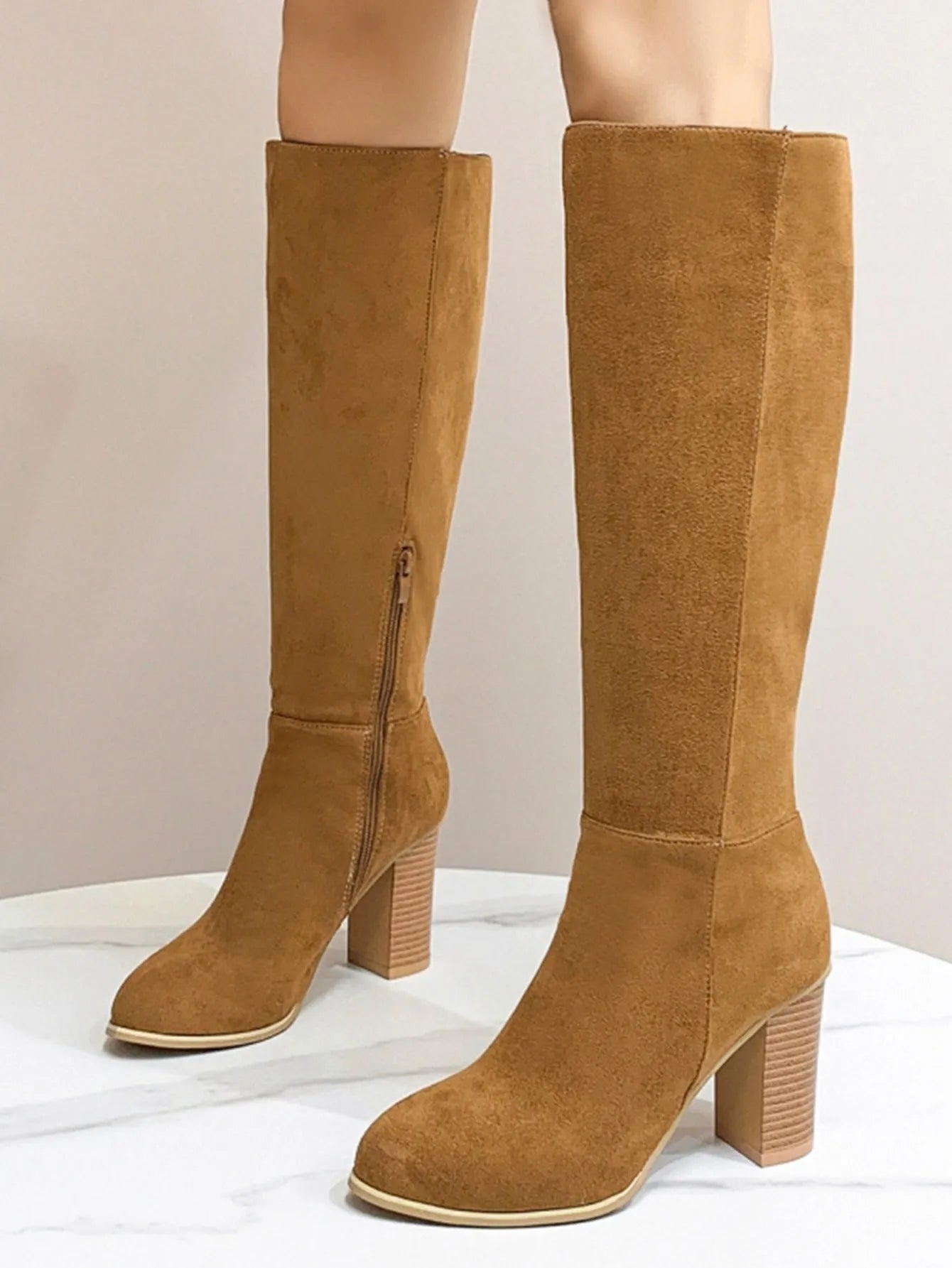 Women's square toe high heel boots in black or dark brown, showing artificial PU upper construction