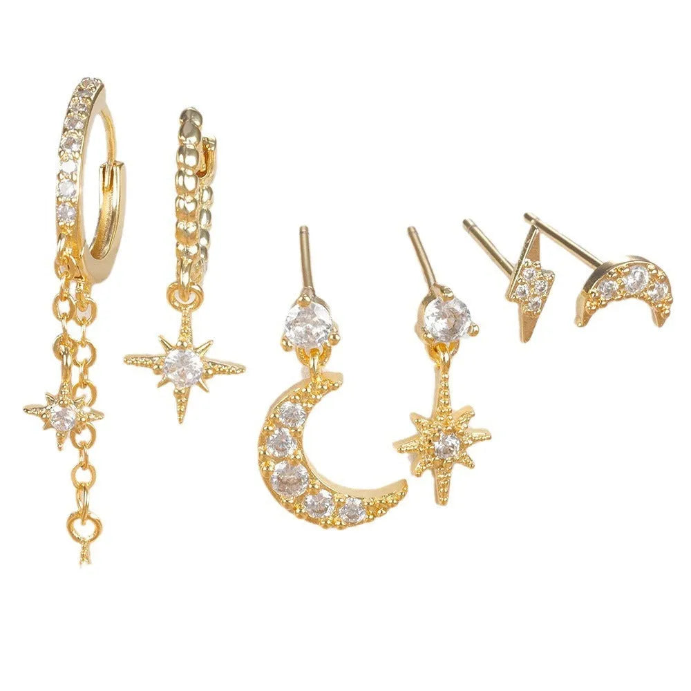 Six gold-colour chain tassel earrings with zircon detail arranged as a complete set