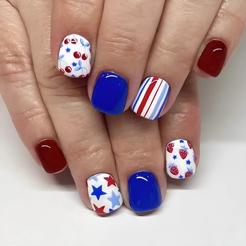 Short glossy red and blue nail stickers with strawberry and cherry pattern, pack of 24.