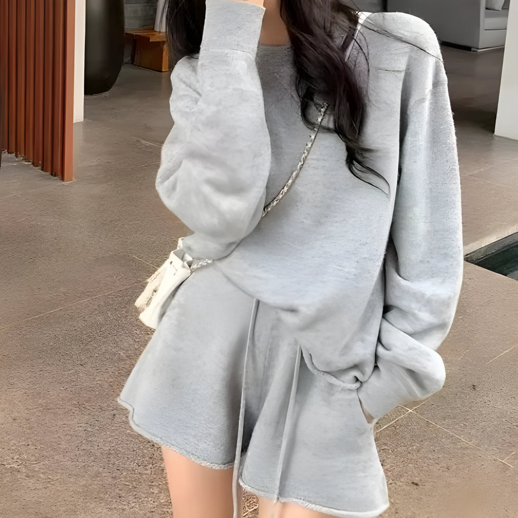 Women's loose-fitting long sleeve sweater and wide-leg shorts two-piece set in a neutral colour.