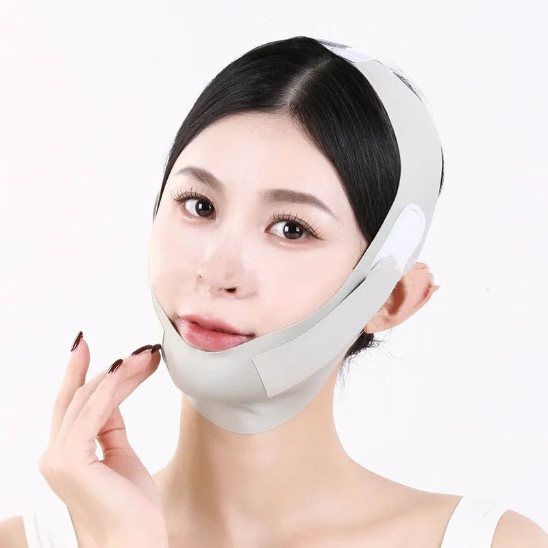 Small V face shaping mask in purple and green colours with breathable fabric construction