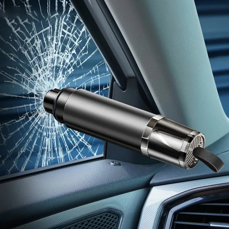 Black and red car emergency window breaker and seat belt cutter tool with mounting bracket on a grey background.