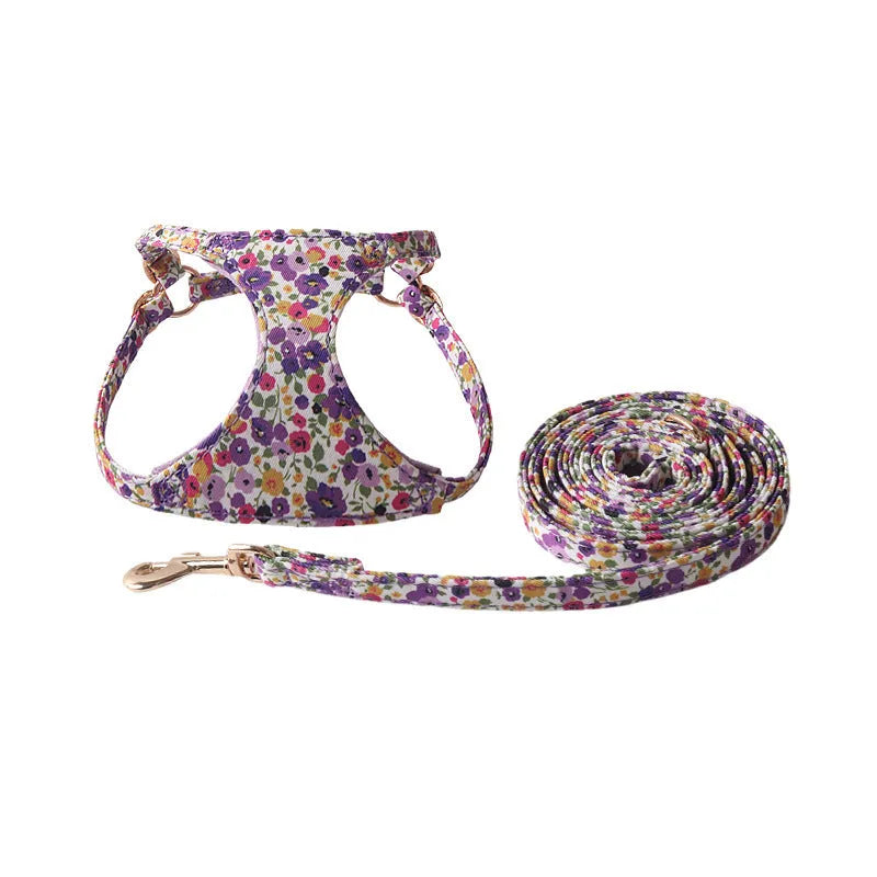 Cloth dog harness and leash set shown in various colours including a floral print, for small dogs.