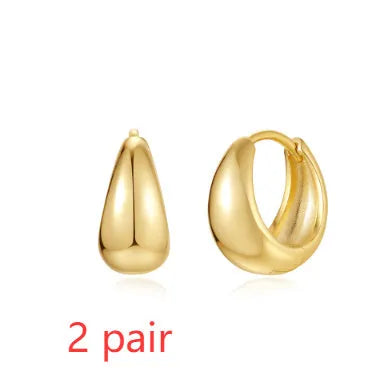 Brass geometric earclip earrings with electroplated gold finish and round design element
