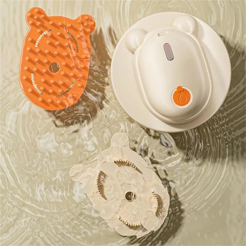 Pink rechargeable pet grooming brush with steam spray function and removable silicone comb teeth.