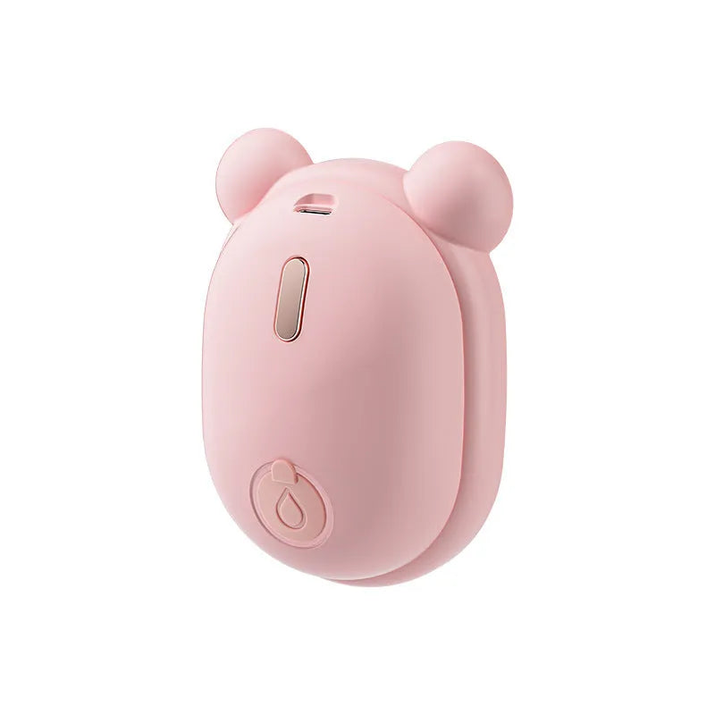 Pink rechargeable pet grooming brush with steam spray function and removable silicone comb teeth.