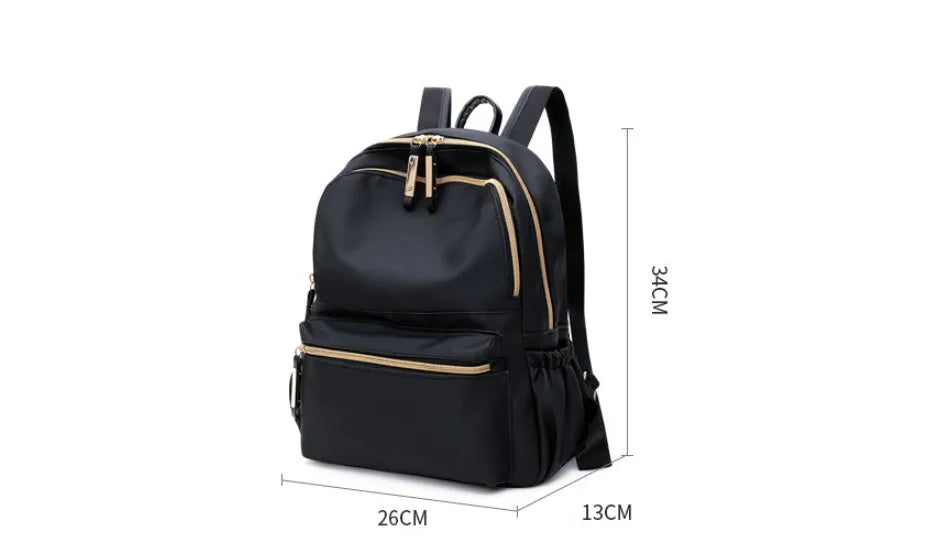 Black waterproof Oxford backpack for women, 34cm high, showing front view on plain background