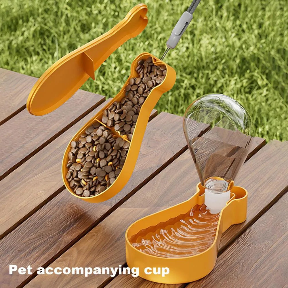 Orange and white portable pet water bottle with attached food container for travel