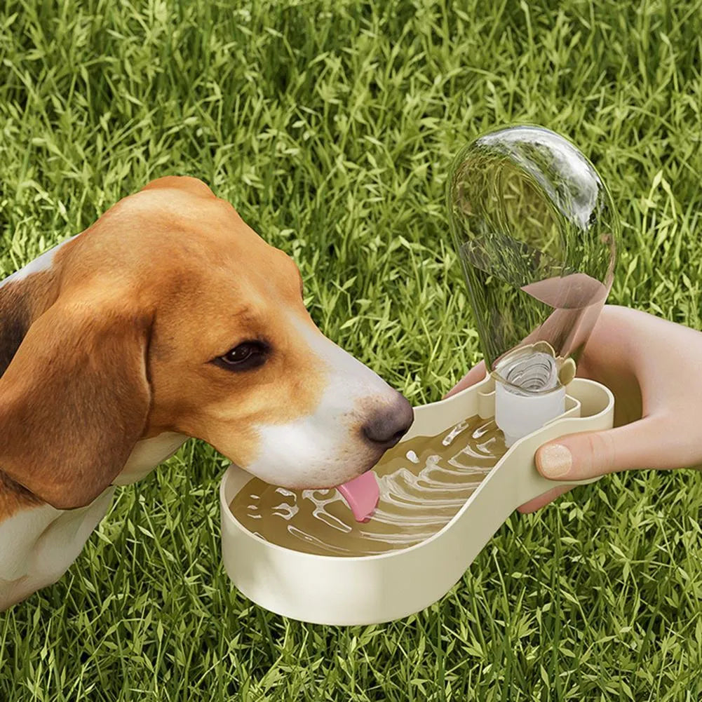 Orange and white portable pet water bottle with attached food container for travel