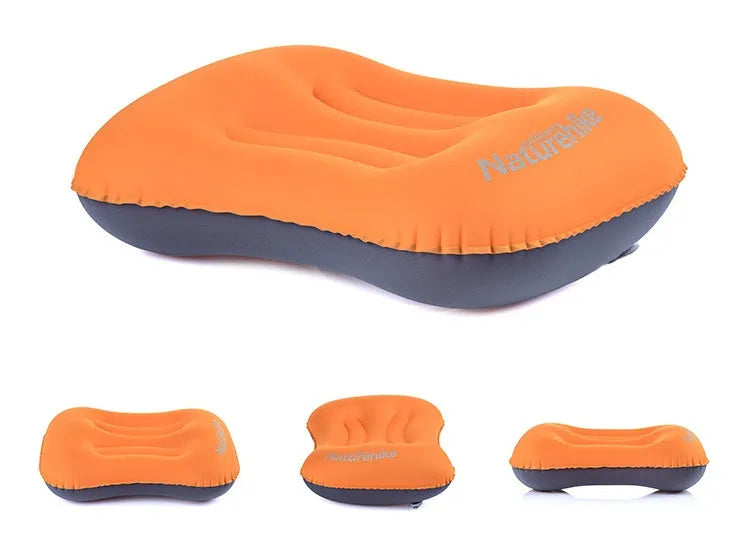 Travel portable inflatable pillow in bright orange with air mouth for camping outdoor sports