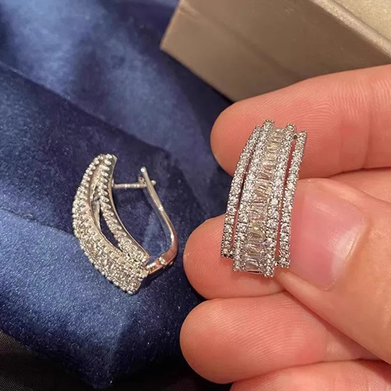 Women's geometric zircon stud earrings with white gold colour plating.