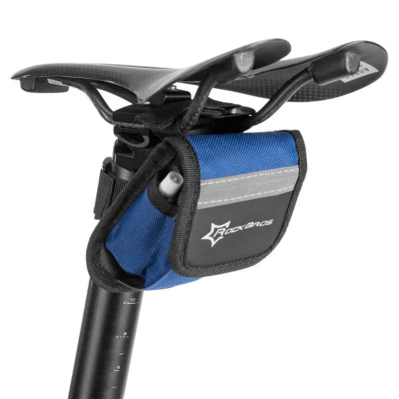 Bicycle tire repair kit in portable storage bag mounted on upper tube of bike frame