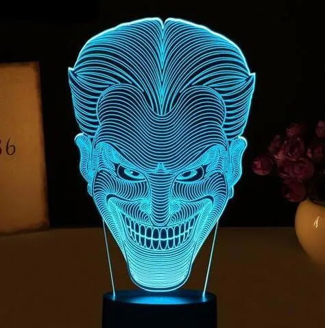 USB-powered acrylic 3D LED table lamp displaying blue light on a desk