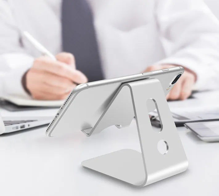 Aluminium Universal Phone Buddy stand holding a mobile phone, shown in silver finish.
