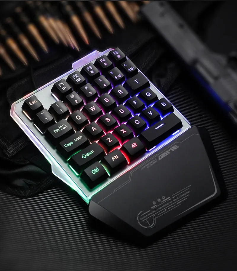 G40 Flow Colour black one-handed robotic keyboard with RGB backlit keys on a desk