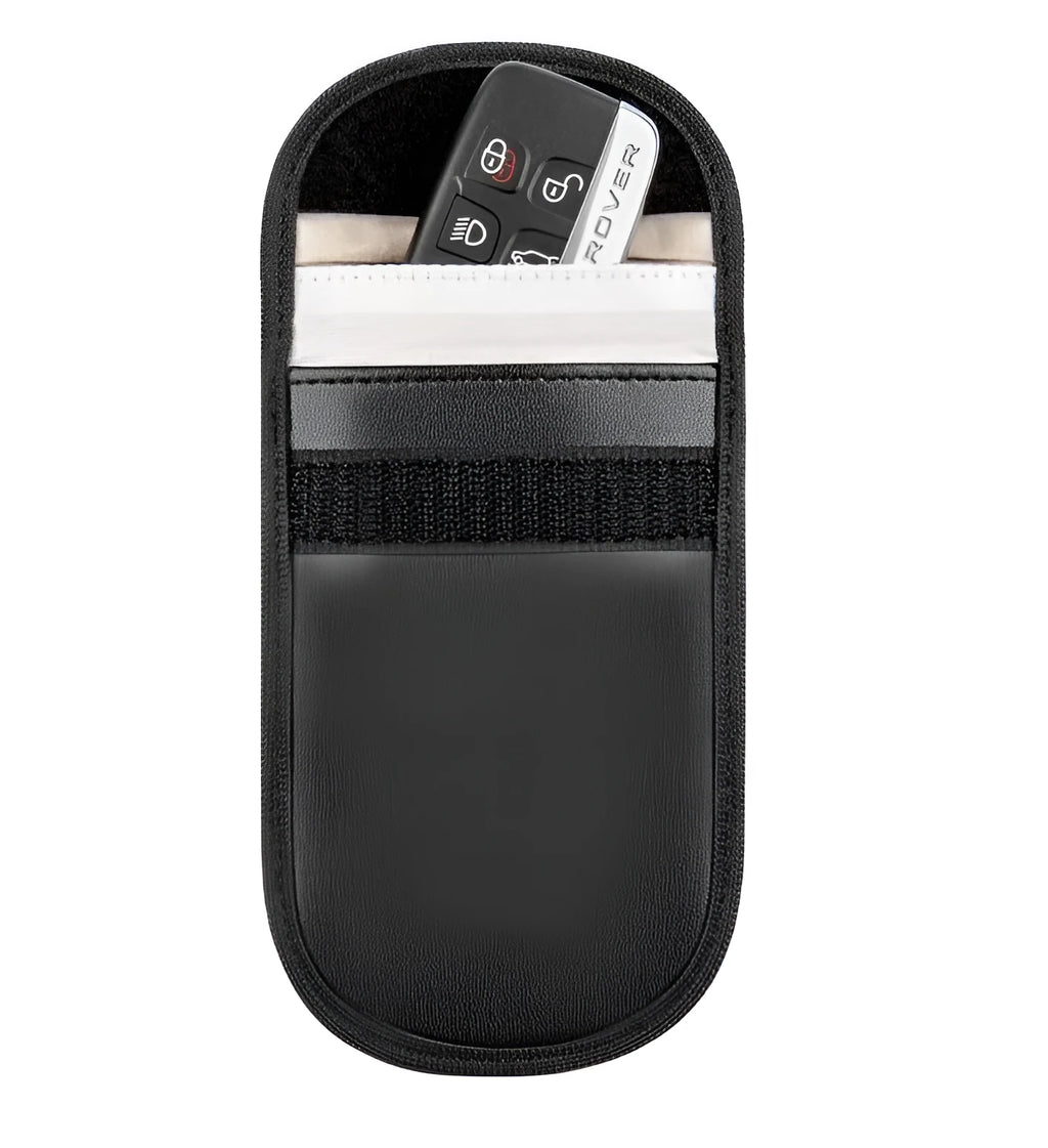 Black microfibre Faraday pouch for blocking car key, phone, and bank card signals, shown with a key fob inside.