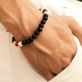 Natural lava stone essential oil diffuser bracelet with ethnic beads measuring 18cm