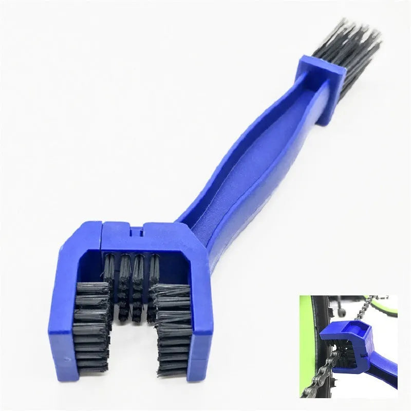 Blue plastic bicycle chain cleaning washer set with brushes on a bike chain