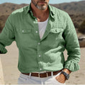 Men's solid colour long-sleeved cotton linen shirt in a loose fit, shown in green.
