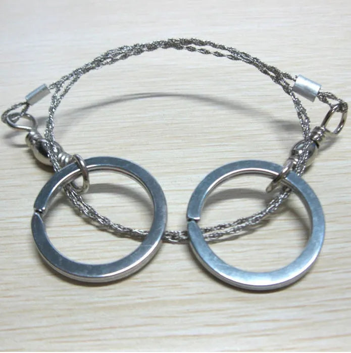 Multifunctional survival wire saw with stainless steel cutting wire and metal pull rings extended to full length