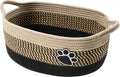 Hand-woven light beige cotton rope storage basket with wooden handle for home organisation
