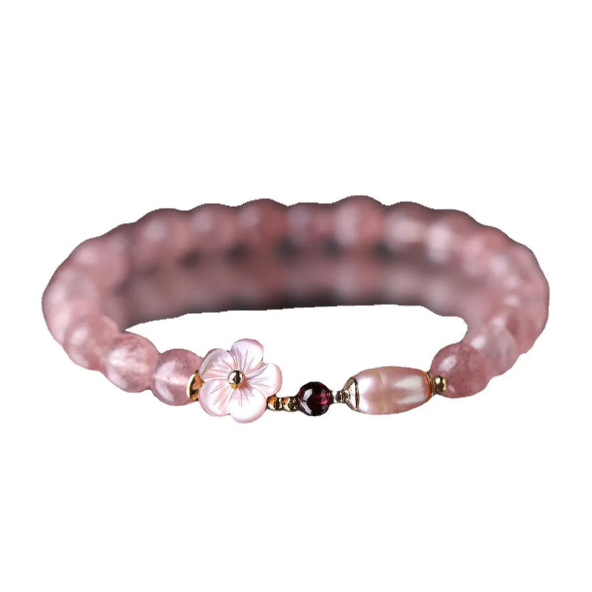 Strawberry quartz peach blossom crystal bracelet with floral design on wrist