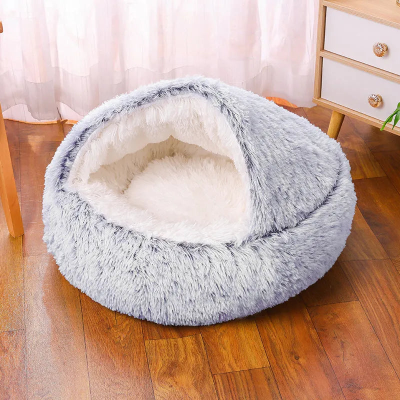 Semi-surrounded soft cloth dog kennel in champagne colour with a removable cushion inside.