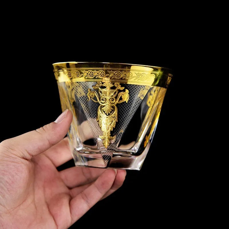 Gold line crystal glass whisky tumbler set with bottle and six glasses on white background