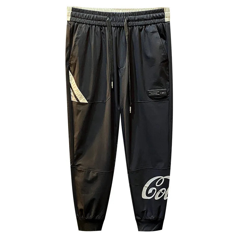 Man wearing black ultra-thin ice silk cropped trousers with elasticated ankle bands.