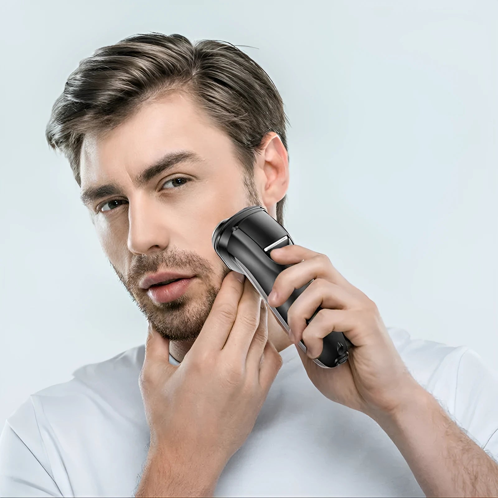 Men's electric shaver with three rotating floating heads and LED display shown with USB cable and grooming accessories.