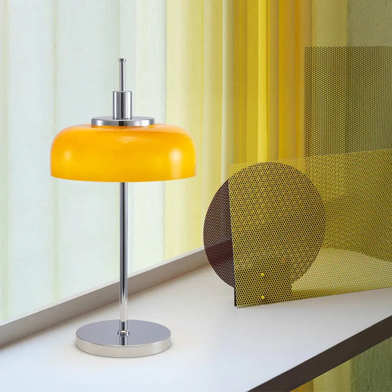 Retro table lamp with glass lampshade and chrome finish on a wooden surface