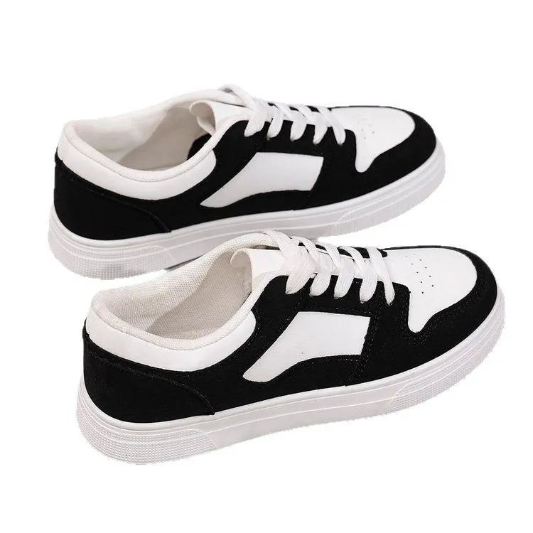 Black women's casual sports shoes with round toe and lace-up front, featuring a low top and flat rubber sole.