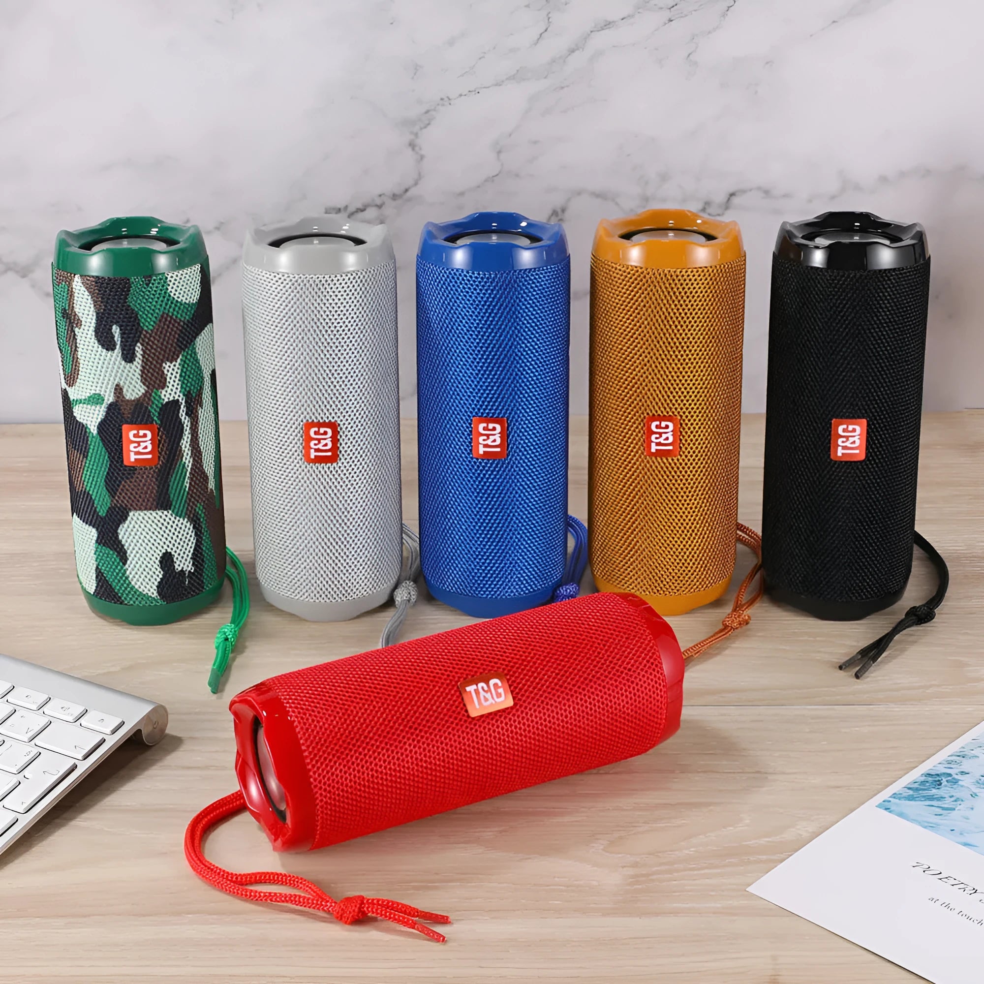 Fabric-covered portable Bluetooth speaker with a card slot in multiple colour options.