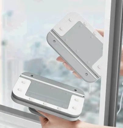 Magnetic double-sided window cleaner with silicone scraper on glass surface, 10x15x4cm size, white ABS body