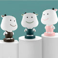 Cartoon animal table lamp in Bear, Cattle, Rabbit or Tiger design with LED light and plastic shade.
