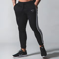 New Muscle Brother cotton sports trousers in black, 95 percent cotton, elastic waist, side view on model