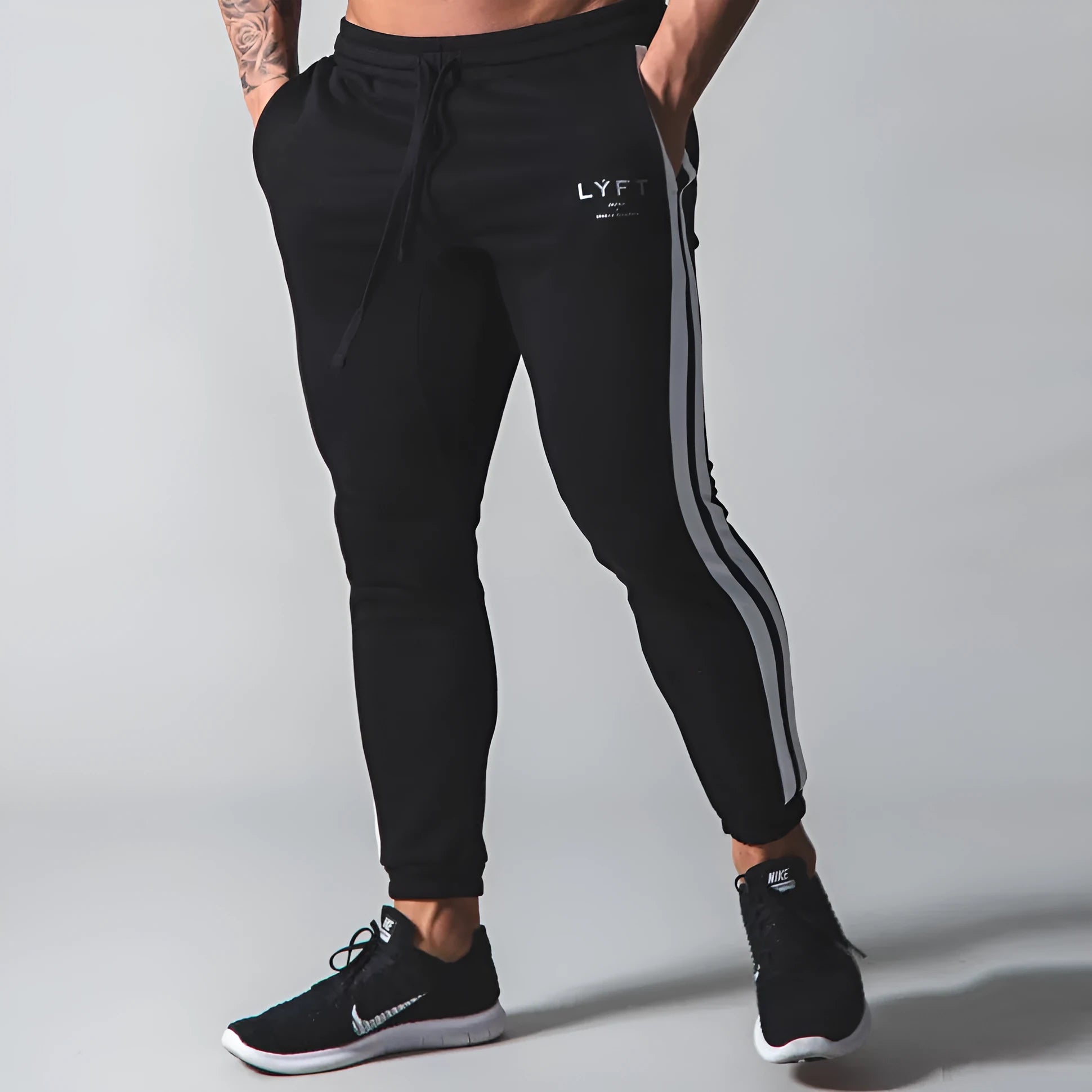 New Muscle Brother cotton sports trousers in black, 95 percent cotton, elastic waist, side view on model