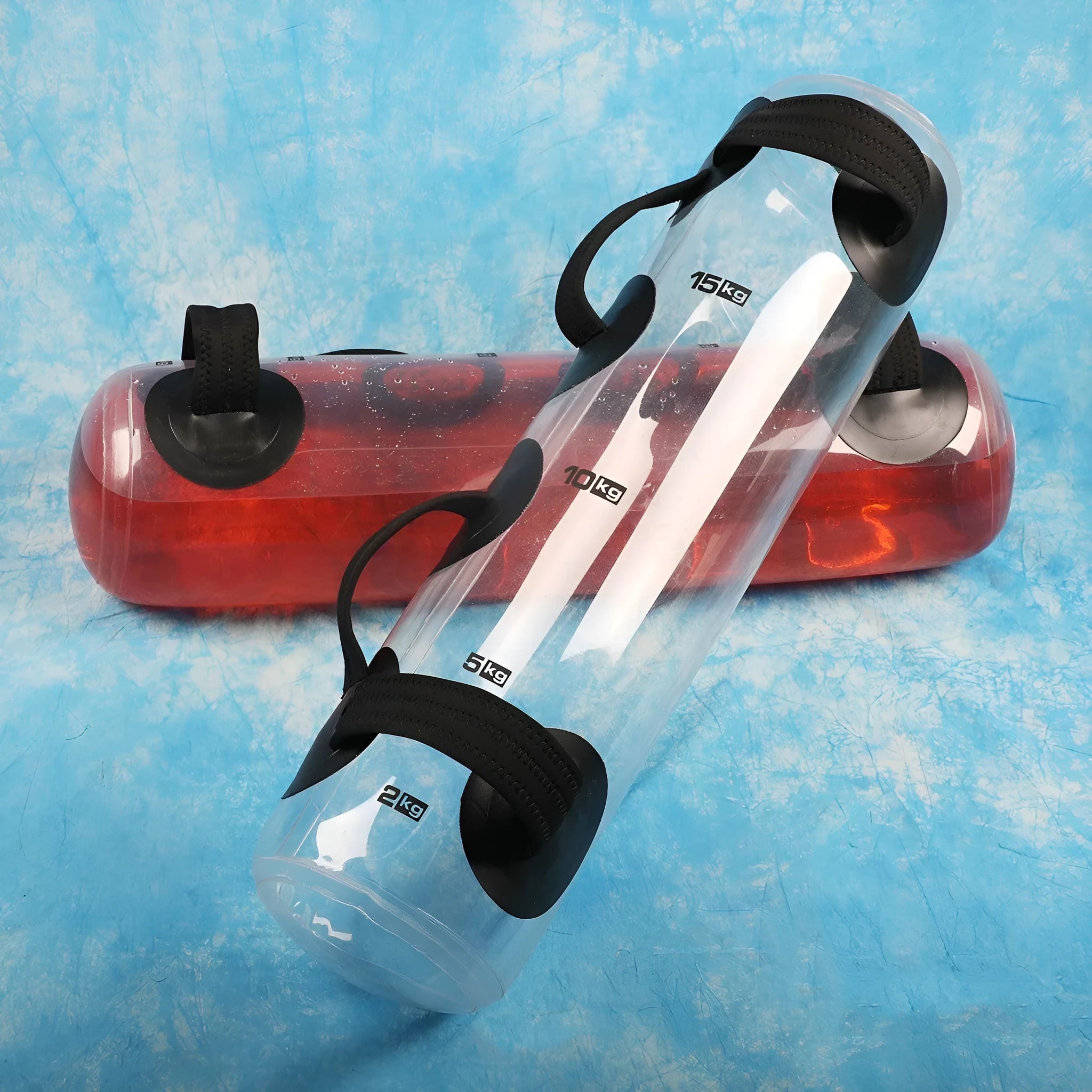 Transparent PVC water injection weight training bag showing adjustable fill levels from 5kg to 50kg capacity