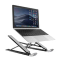 Adjustable folding laptop stand in silver, open on desk with laptop, showing hollow bottom and non-slip silicone pads