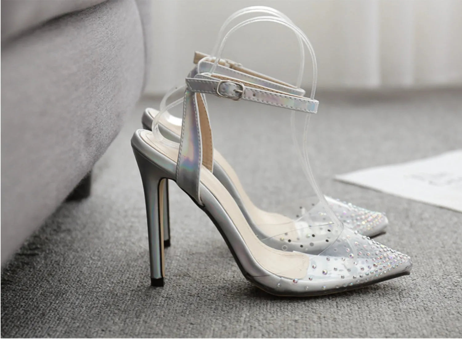 Women's pointed toe diamond sandals with a stiletto heel and PVC upper, shown in available sizes.