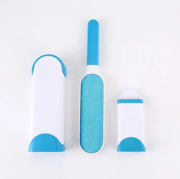 Blue reusable pet hair removal comb with double-sided brush next to its self-cleaning base.