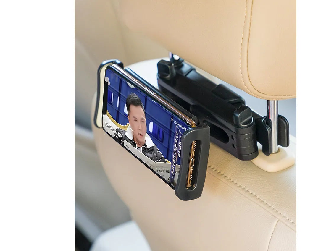 Black universal car phone holder mounted on rear seat centre armrest with tablet secured in snap-in mount