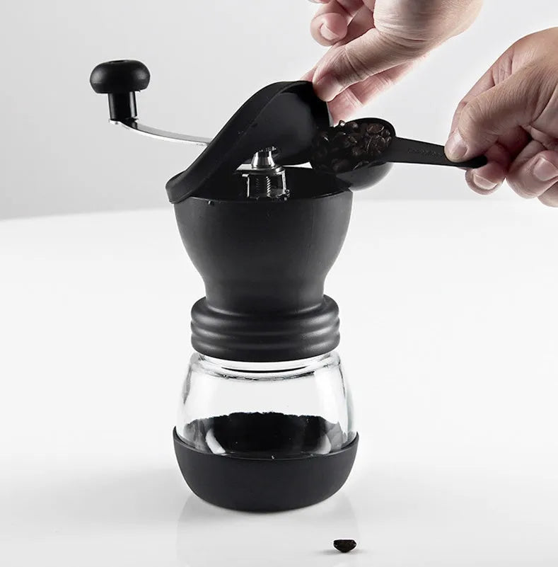 Hand grinder coffee machine with beech wood body and black finish on a countertop, width 88mm