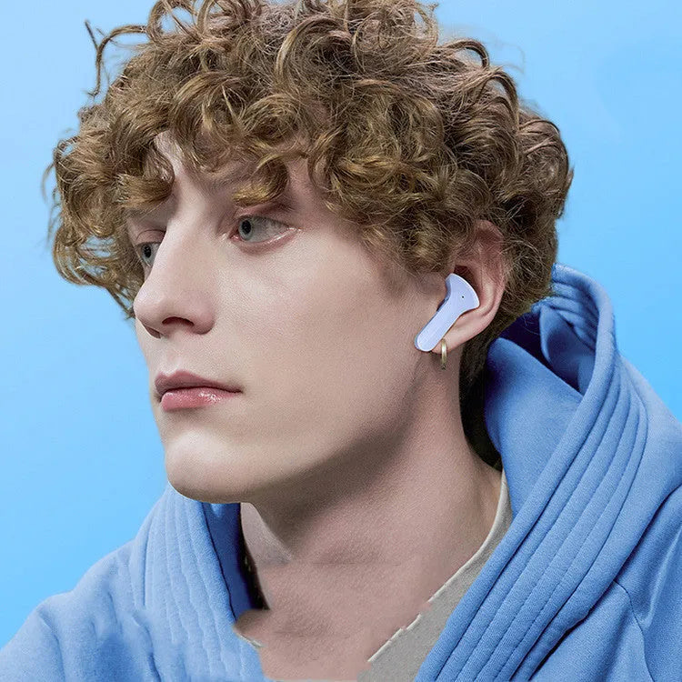 Mini wireless Bluetooth headset in charging compartment with LED battery display, pink colour, silicone case, and USB-C cable