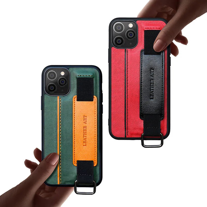 Brown imitation leather iPhone case with a wristband strap looped around a hand.